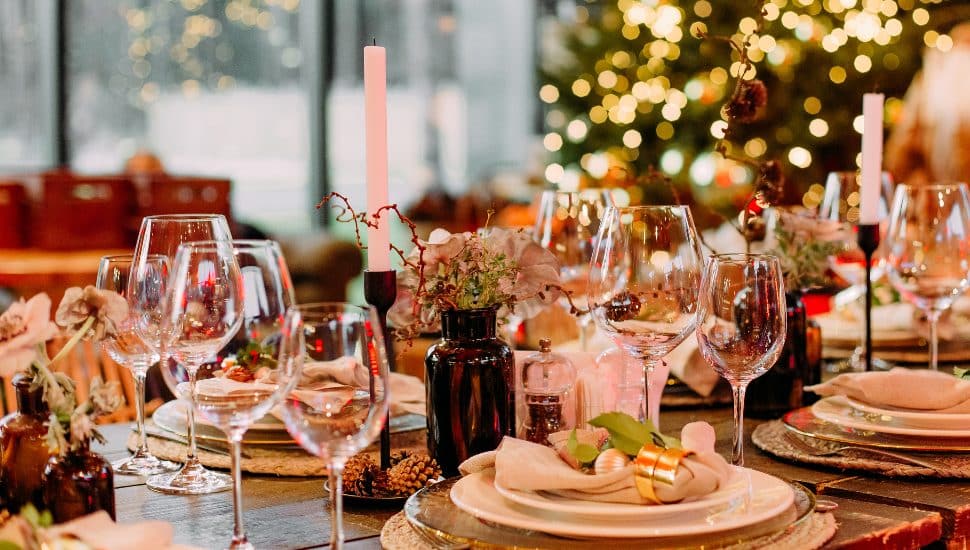 A festive large table decorated with Christmas decor.