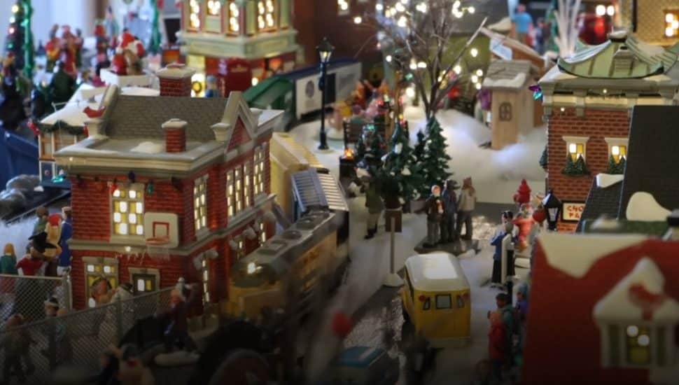 Miniature buildings and a train in the Filling family's Christmas village.