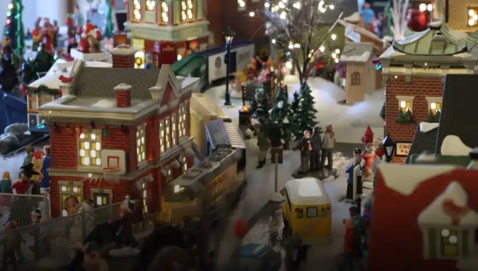 Miniature buildings and a train in the Filling family's Christmas village.