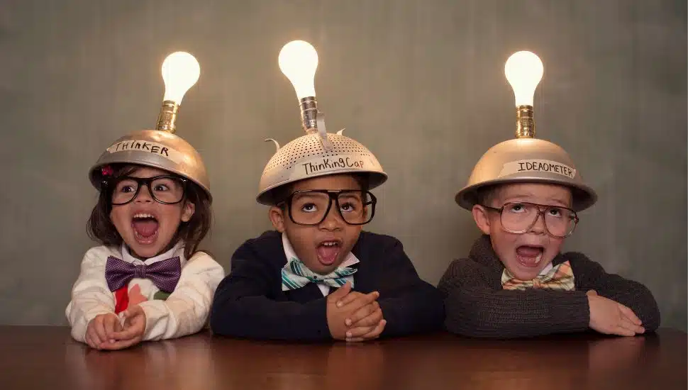 Kids in crazy hats with lights on their heads.