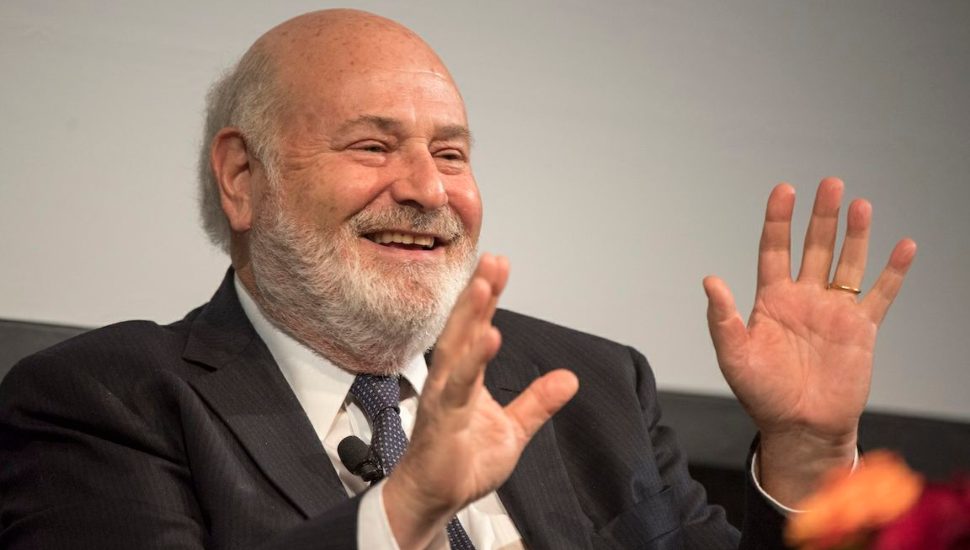 Rob Reiner speaking with hands up.