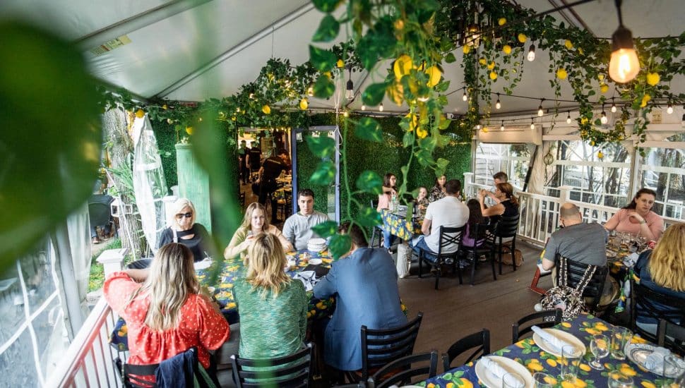 Vecchia Osteria interior with people dining.