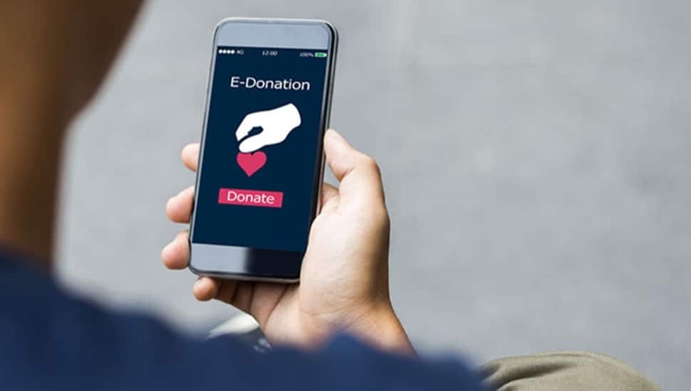 Person makes charitable donation on their mobile phone.