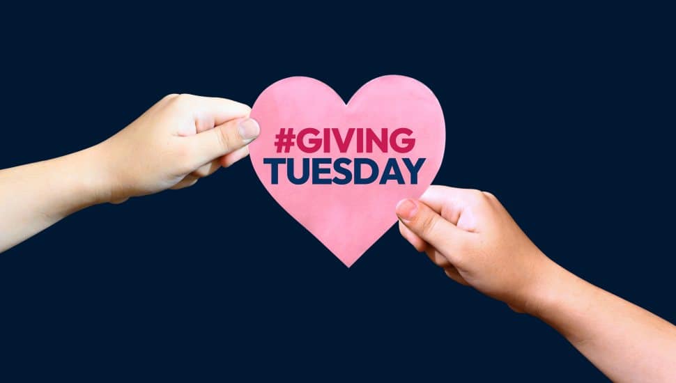 Giving Tuesday backdrop showing giving hand to hand heart with typography written on it. The day is celebrated after thanksgiving, background.