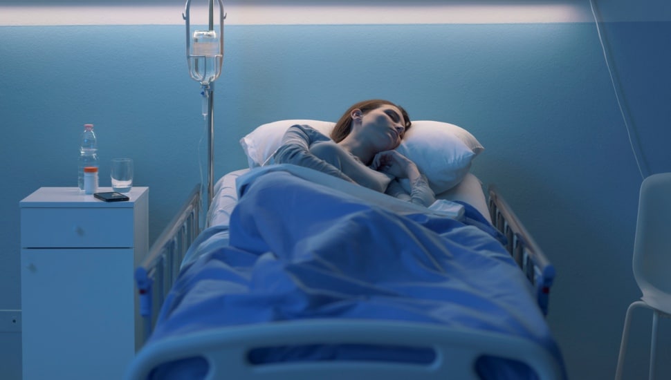 Person in hospital bed.