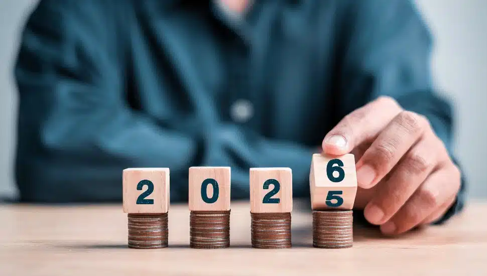 2026 blocks on top of pile of coins.