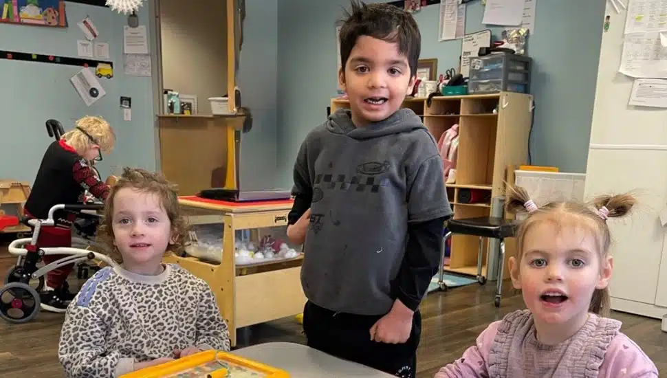 A boy and two girls share some play time at the Arc of Chester County preschool.