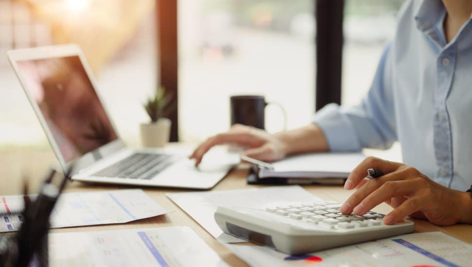 Businessman typing on computer.
