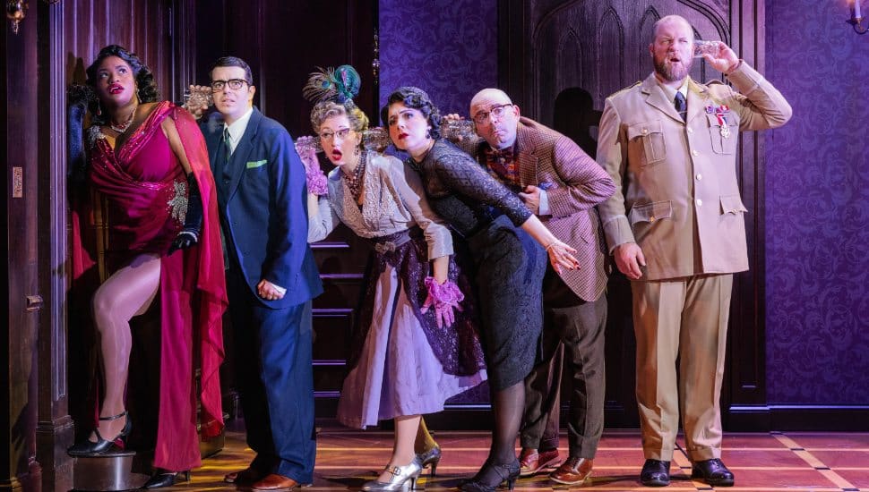 Madeline Raube, center, in Ensemble Arts Philly's production of 'Clue.'