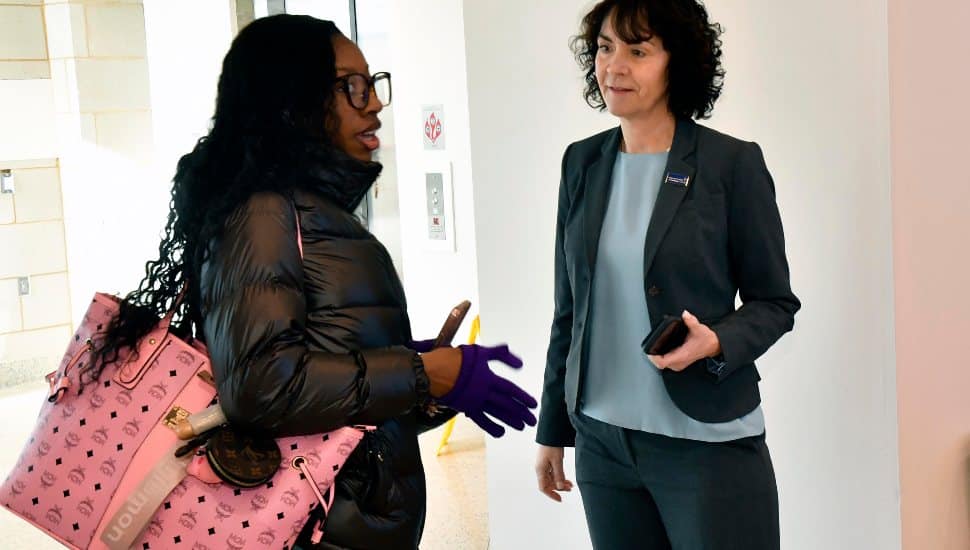 DCCC President Dr. Marta Yera Cronin greets a student at Southeast Center.