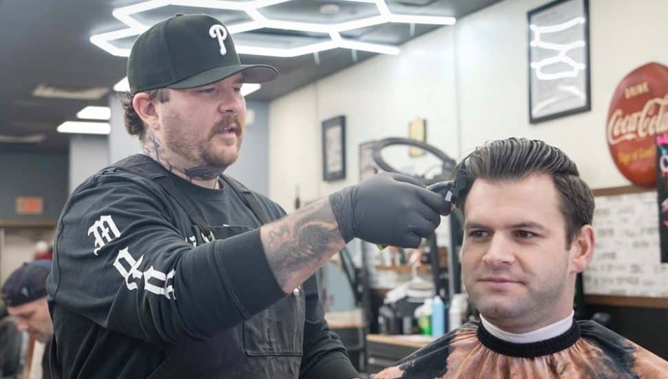 Manager Justin Kyle giving a haircut at Iron's Edge Barber Co.