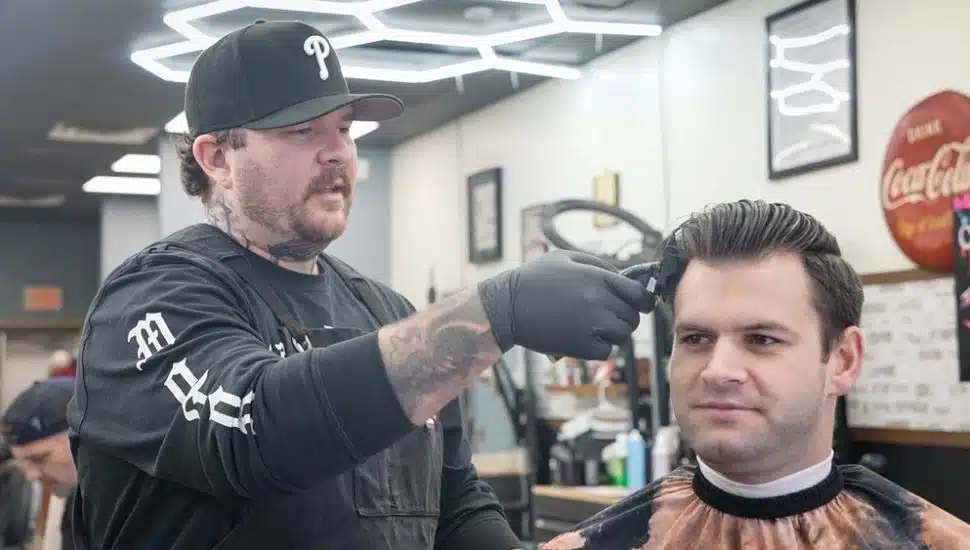 Manager Justin Kyle giving a haircut at Iron's Edge Barber Co.