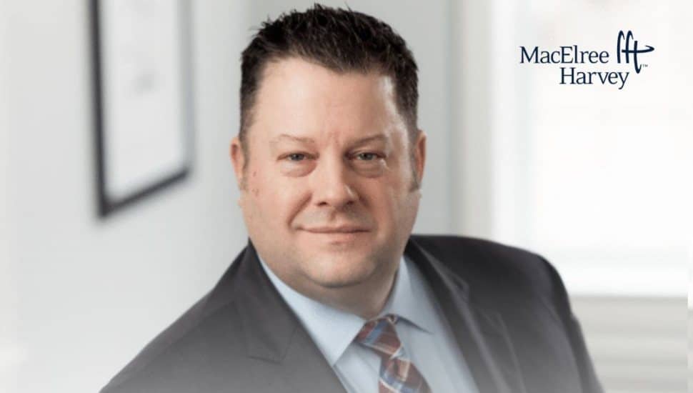 Photo of Judge Lou Mincarelli smiling at a MacElree Harvey office event announcing his return to the firm’s Litigation Department.