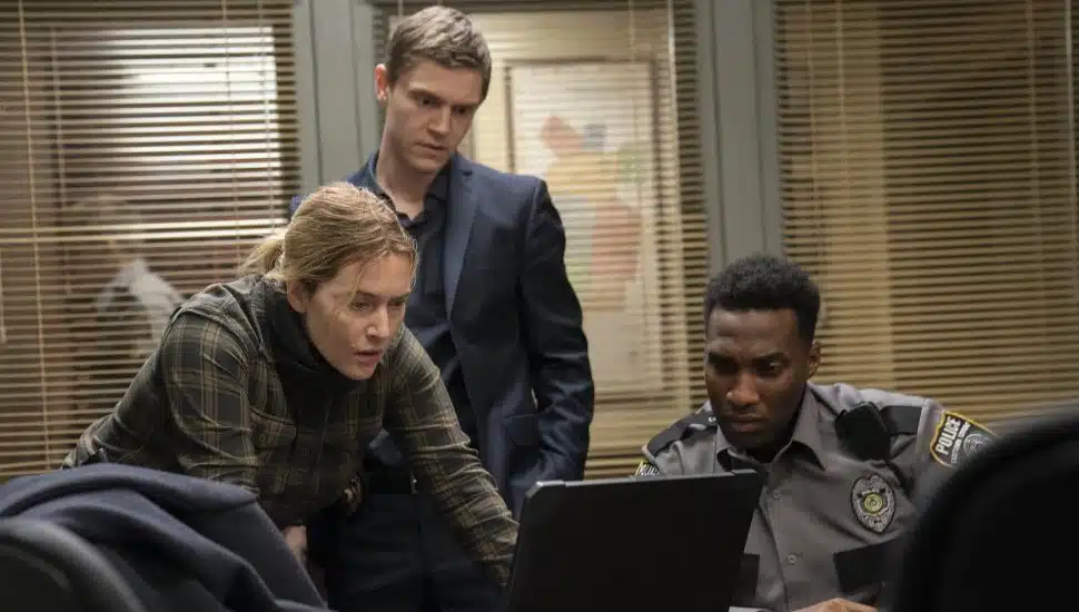 Kate Winslet, Evan Peters, and Justin Hurtt-Dunkley in HBO's 'Mare of Easttown.'