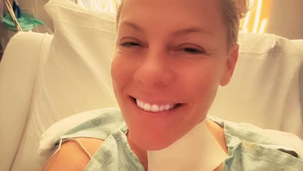 Pink in hospital bed.