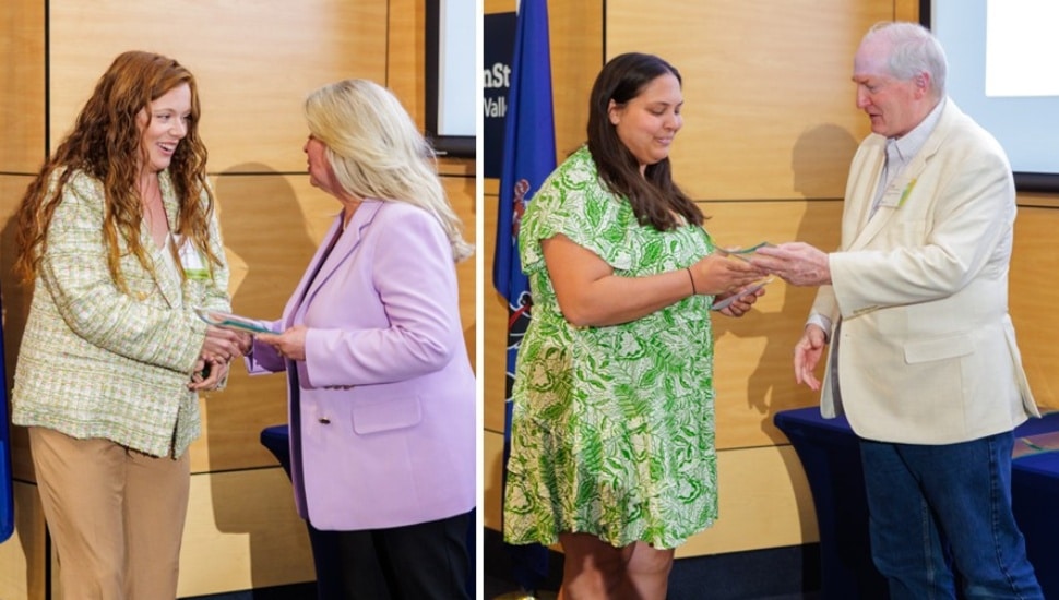 Two women receive awards at ceremony.