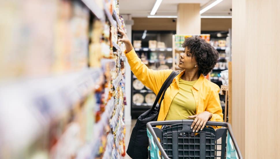 Woman shopping in grocery store.