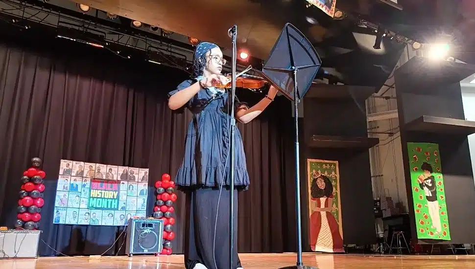 A student performer at Coatesville Area Intermediate High School's Black History Month celebration.