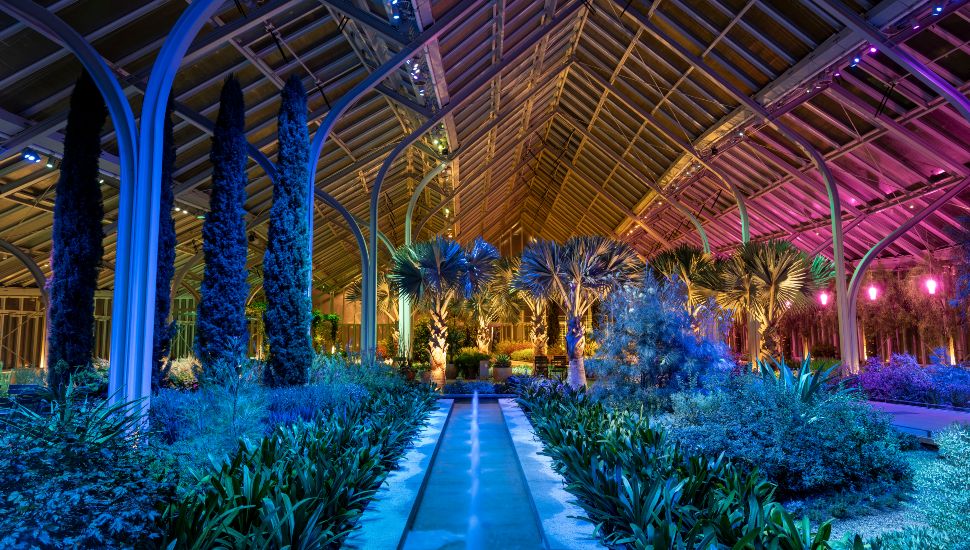 West Conservatory at night with glowing lights.