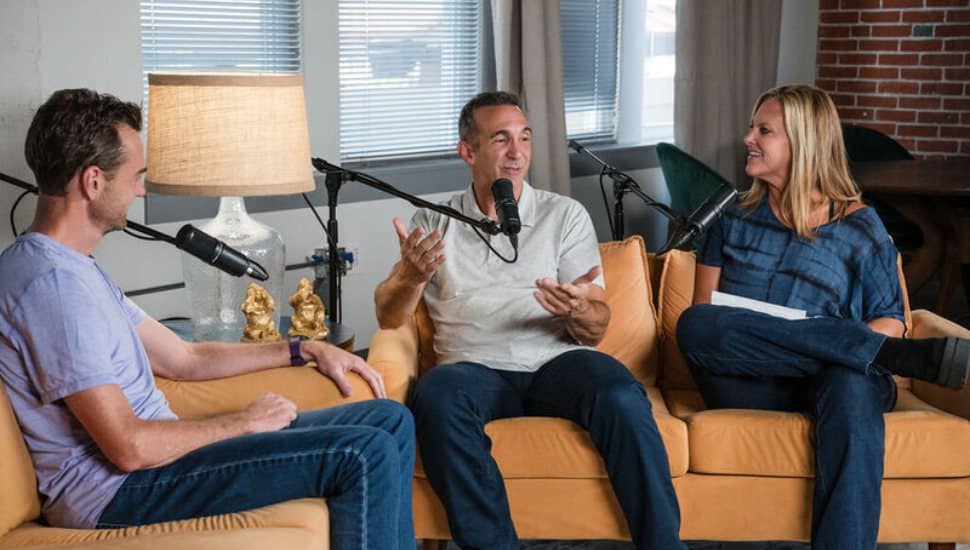 Gurus and Game Changers hosts recording a podcast episode.