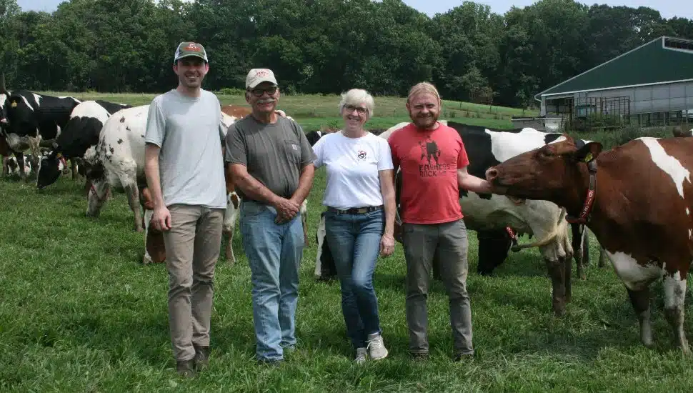 The Miller family alongside the Birchrun Hills Farm cows.