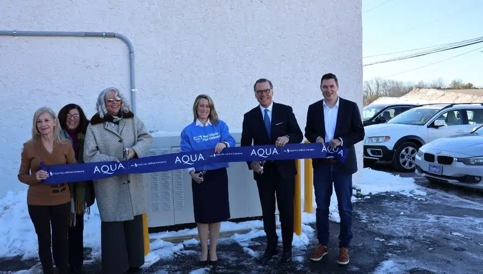 Community leaders and partners celebrate a ribbon cutting for a new generator at West Chester Food Cupboard, funded by Aqua Pennsylvania.