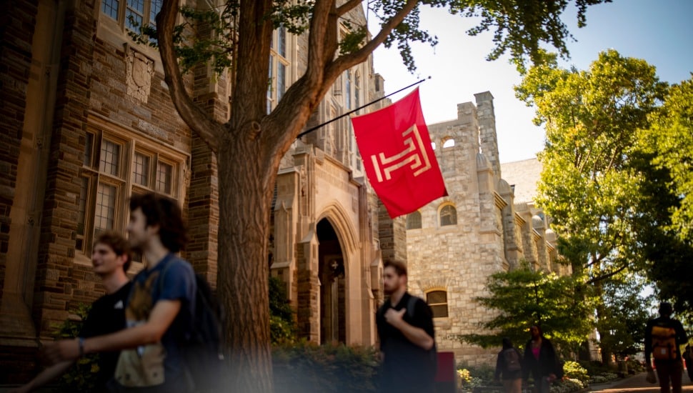 Temple University campus in sunshine with students.