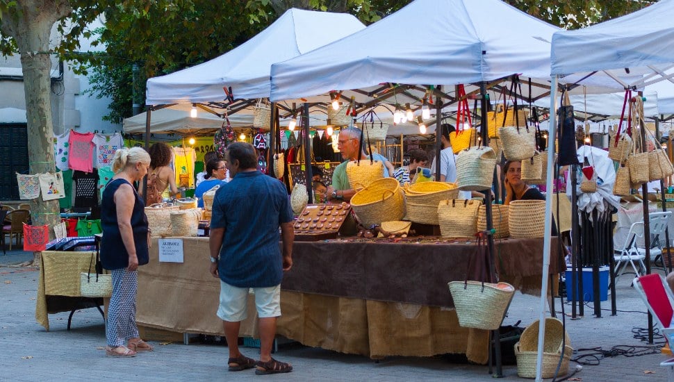 Shoppers at an outdoor craft fair.