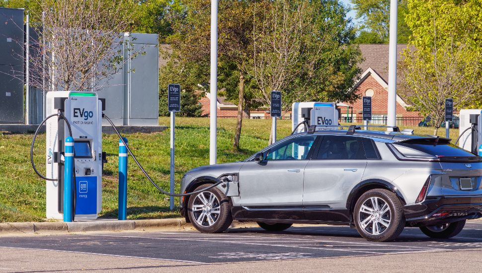 An electric vehicle at a charging station.