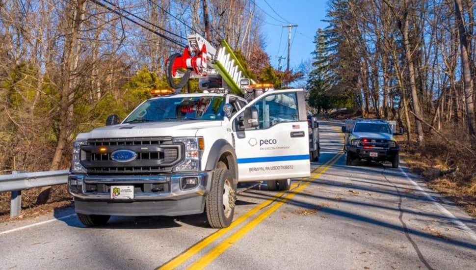 Utility truck parked in road.
