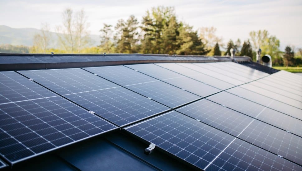 Solar panels line a rooftop.