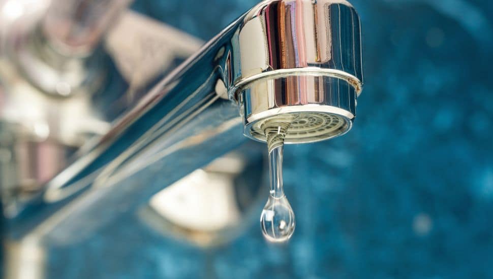 Leaky faucet close-up.
