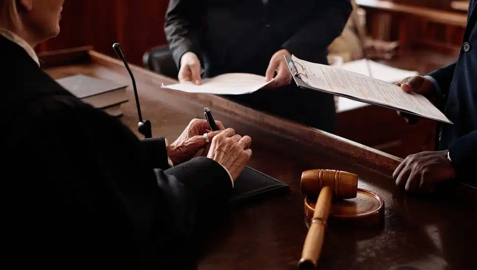 Judge and lawyers at the bench.