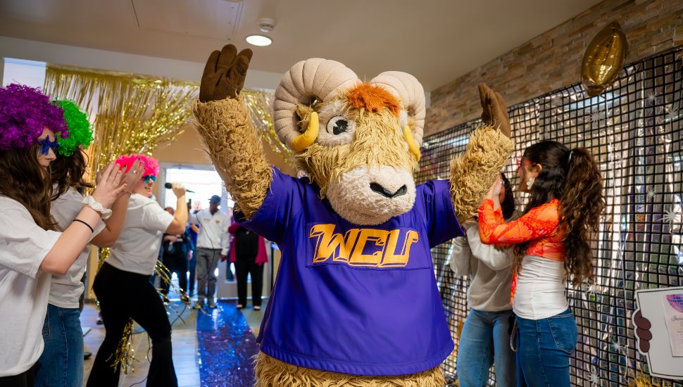 West Chester University Rammy mascot celebrating WCU Week with students and festive decorations.