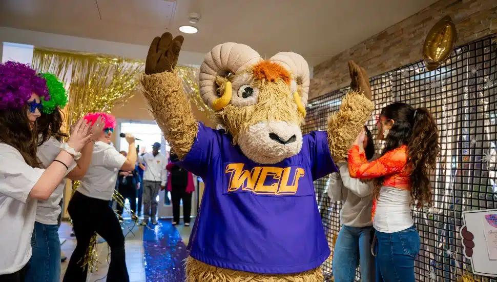 West Chester University Rammy mascot celebrating WCU Week with students and festive decorations.
