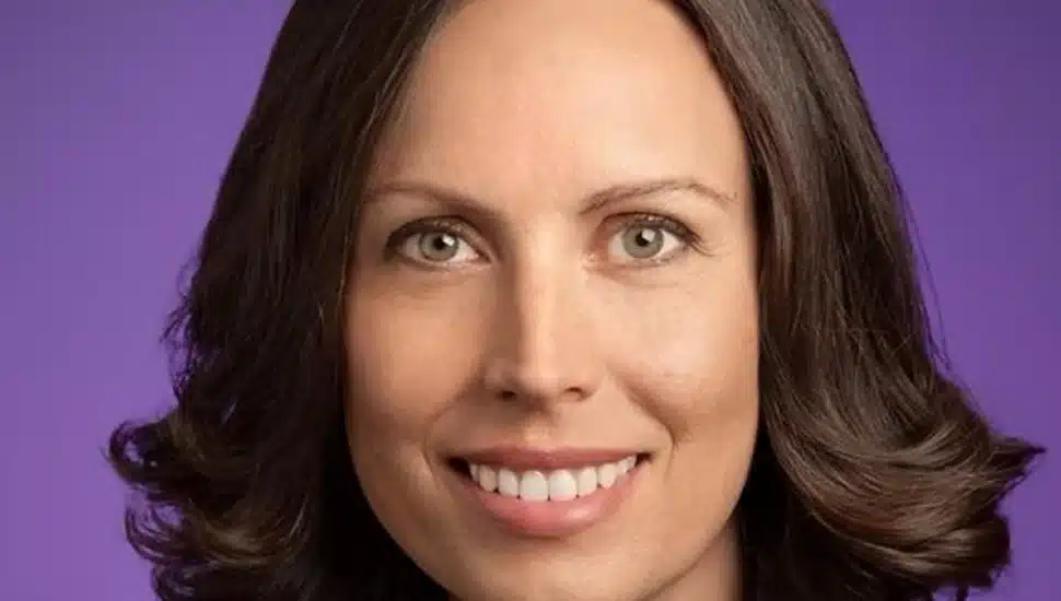 Headshot of female tech executive with dark hair.