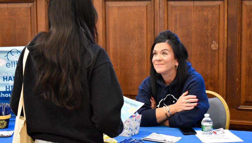 High school students interact with professionals at tables during the Chester County Futures Career Expo at Immaculata University.