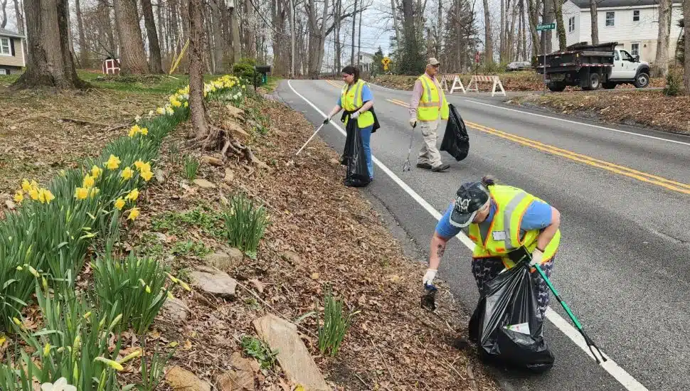 Chester county government officials and Litter Lifters volunteers cleaning up roadside trash.