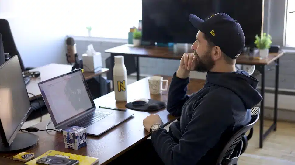 Matt Canning deep in thought at his desk.