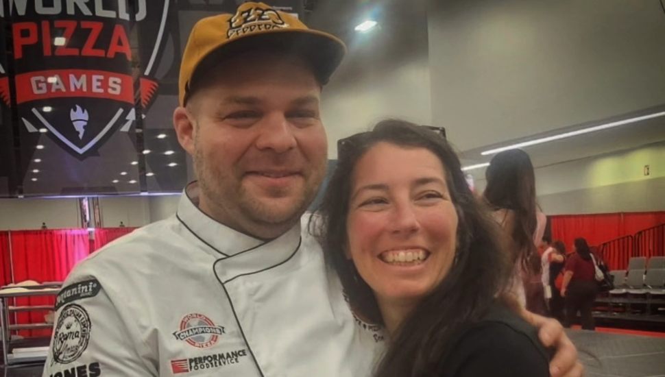 Ben and Samantha Tobin smiling together at pizza competition.