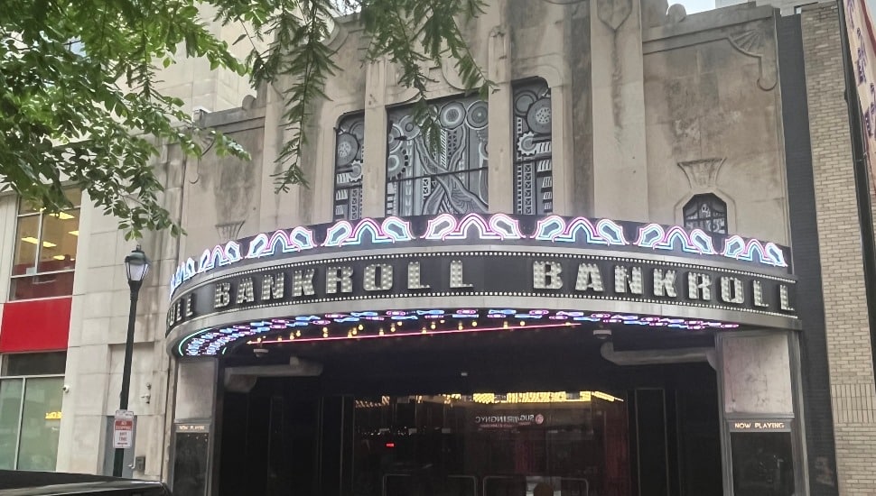 The Boyd Theatre marquee lit up with neon lights displaying "Bankroll" on Chestnut Street in Center City Philadelphia.