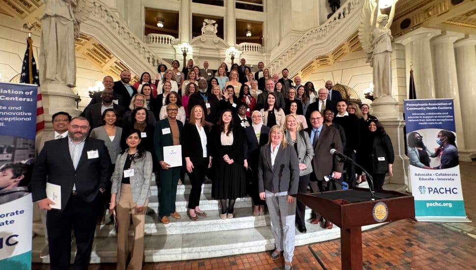 Leaders and representatives from Federally Qualified Health Centers across Pennsylvania gather on the steps of the Pennsylvania State Capitol rotunda during PACHC Advocacy Day on April 29, 2026, in Harrisburg, PA.