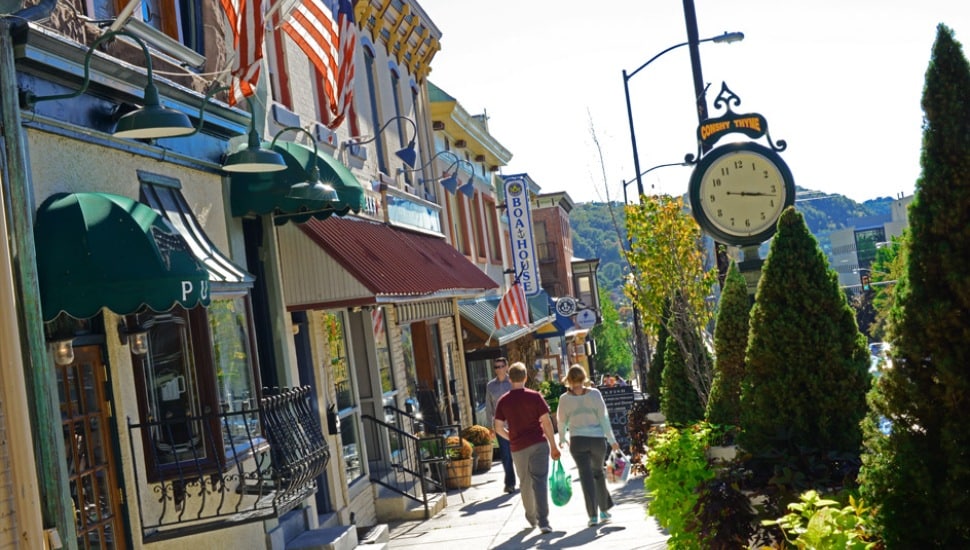 A couple walks down Fayette Street in Conshohocken.