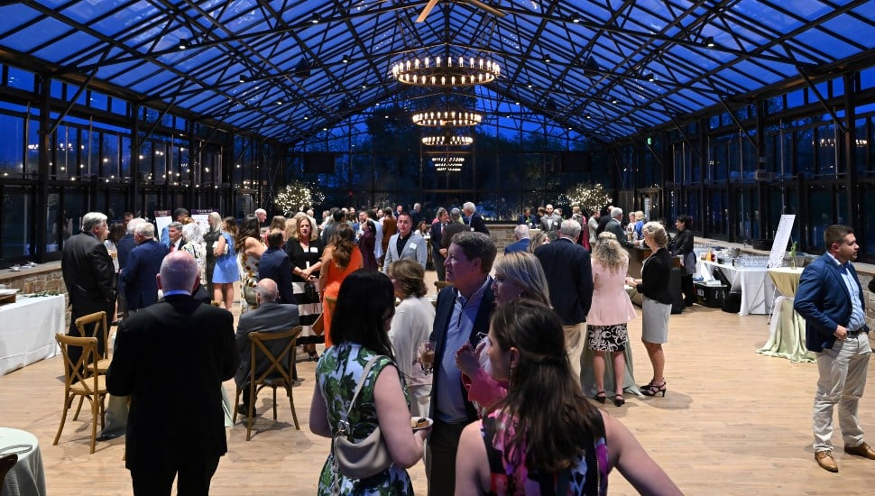 Guests mingle at cocktail hour of event reception.
