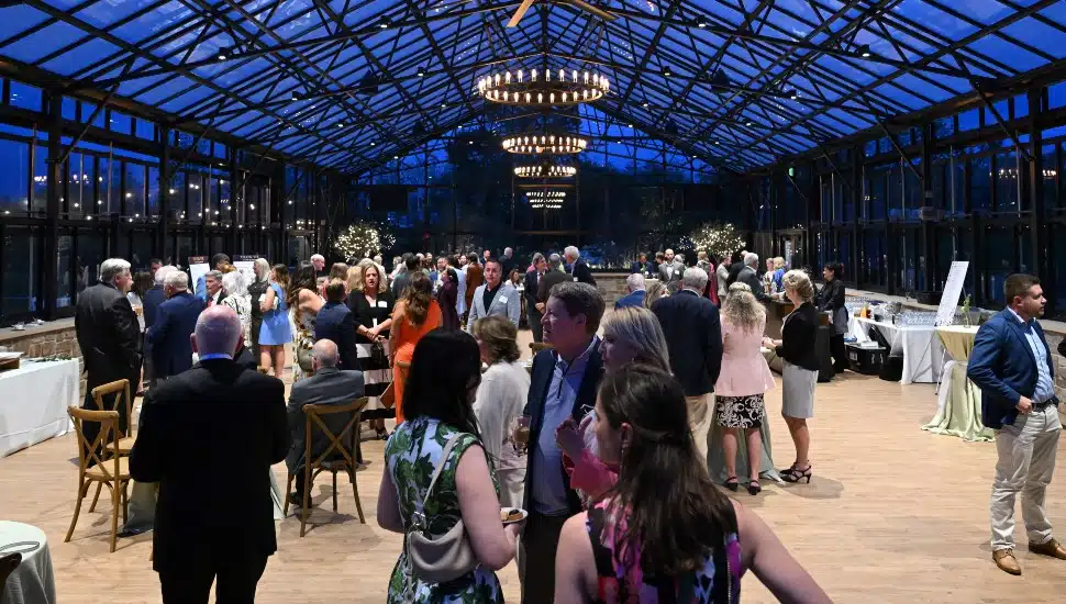 Guests mingle at cocktail hour of event reception.
