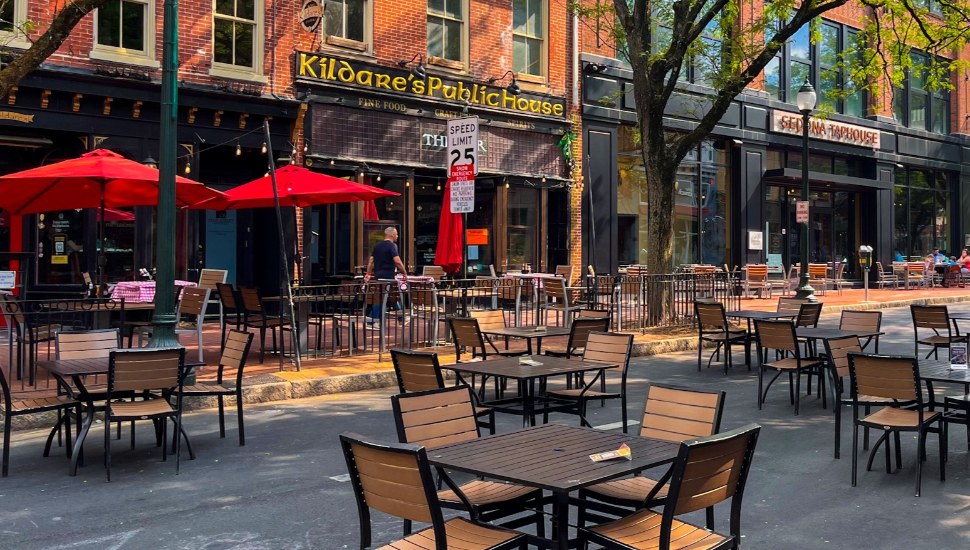 Outdoor dining tables line the street in front of Kildare's Public House in downtown West Chester.