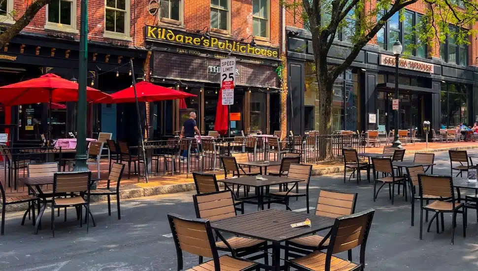 Outdoor dining tables line the street in front of Kildare's Public House in downtown West Chester.
