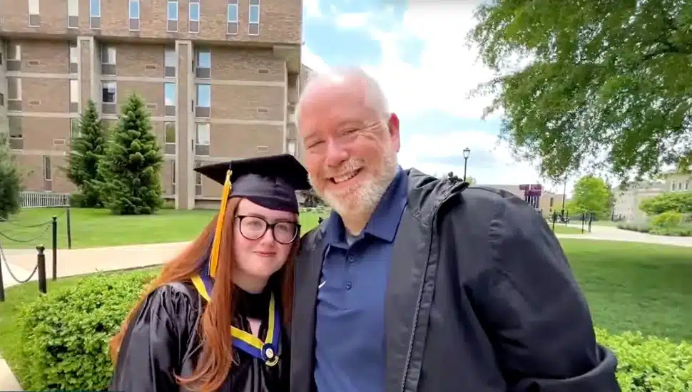 Graduate Marcella Ballisty poses with a family member for her graduation ceremony last Thursday.