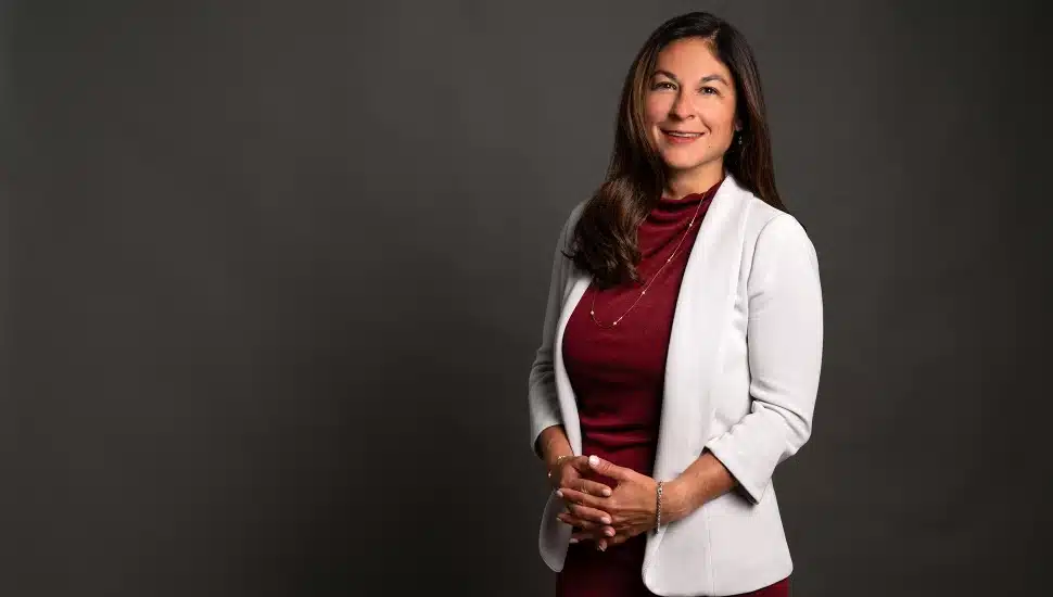Female executive in white jacket.
