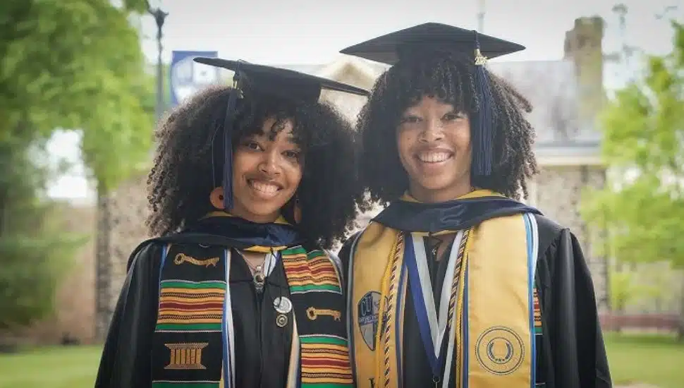 Twin sisters Jasmin and Tia Criss at Cheyney University of Pennsylvania's graduation ceremony.